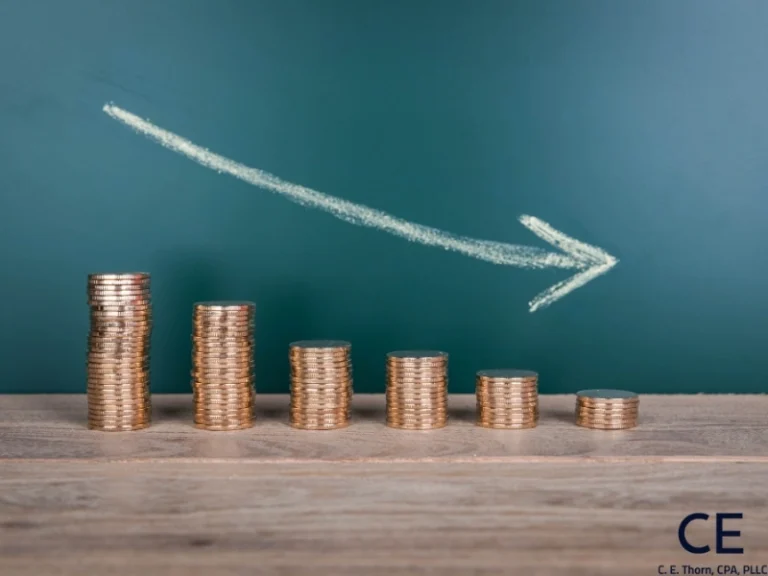 6 stacks of coins arranged from largest stack to the smallest stack to depict how depreciation expense work.